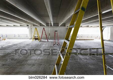 A construction site, the building of a parking garage View Large Photo Image Picture - A construction site, the building of a parking garage. Fotosearch