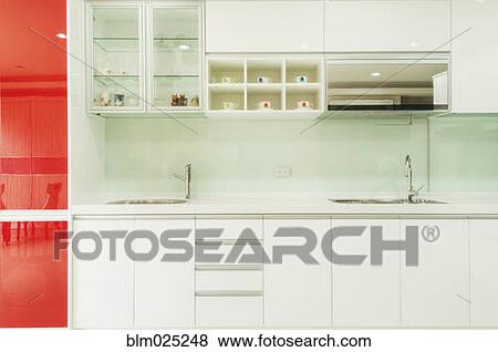 A contemporary style fitted kitchen View Large Photo Image Stock Photo - A contemporary style fitted kitchen. Fotosearch