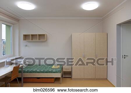 A dormitory bedroom with beds and bed linen View Large Photo Image Stock Photograph - A dormitory bedroom with beds and bed linen. Fotosearch