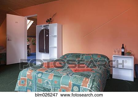 Stock Photo - A double bed in a bedroom. Fotosearch