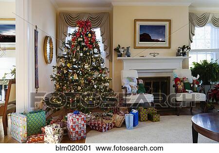 A formal living room with Christmas tree and gifts View Large Photo Image Stock Image - A formal living room with Christmas tree and gifts. Fotosearch
