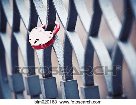 A heart shaped lock left by two lovers on a bridge railing in the city of love, Venice, Italy View Large Photo Image Stock Photo - A heart shaped lock left by two lovers on a bridge railing in the city of love, Venice, Italy. Fotosearch