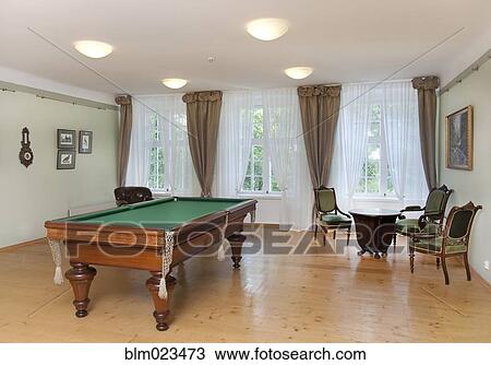 Stock Image - A historic house with antique furniture and traditional landscaped gardens. Fotosearch