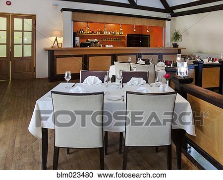 Stock Image - A historic house with antique furniture and traditional landscaped gardens. Fotosearch