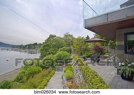 A house terrace overlooking the water View Large Photo Image Picture - A house terrace overlooking the water. Fotosearch