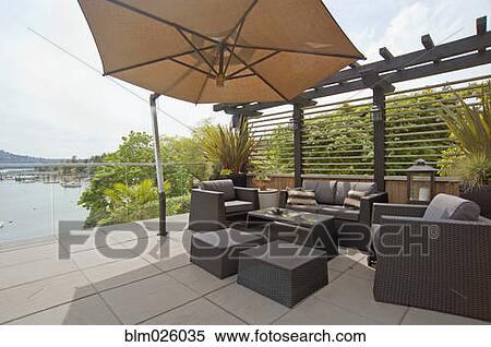A house terrace overlooking the water View Large Photo Image Stock Photography - A house terrace overlooking the water. Fotosearch