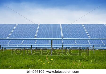A large group of solar panels, tilted at an angle View Large Photo Image Stock Photo - A large group of solar panels, tilted at an angle. Fotosearch