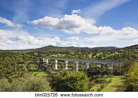 A large highway bridge, an elevated roadway across a gorge, on Sardinia View Large Photo Image Stock Photograph - A large highway bridge, an elevated roadway across a gorge, on Sardinia. Fotosearch