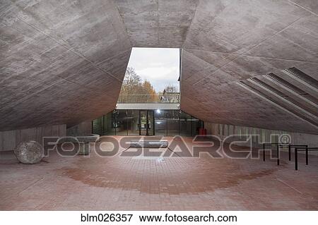 Stock Photo - A large open space with a sloping overhang roof . Fotosearch