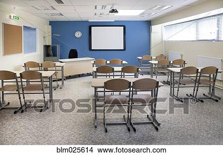 A large room with tables and chairs View Large Photo Image Picture - A large room with tables and chairs. Fotosearch
