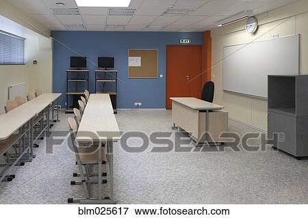 Stock Photo - A large room with tables and chairs. Fotosearch