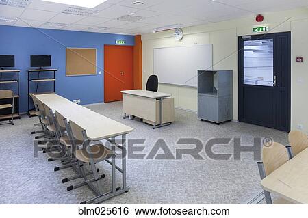 Stock Photograph - A large room with tables and chairs. Fotosearch