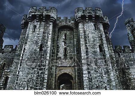Stock Image - A medieval moated 14th century stone built castle. Fotosearch