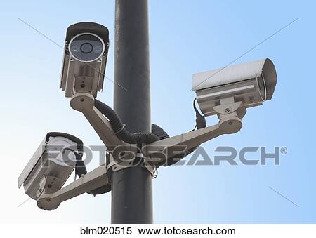A metal post with a gantry and traffic cameras facing in three different directions View Large Photo Image Stock Photography - A metal post with a gantry and traffic cameras facing in three different directions. Fotosearch