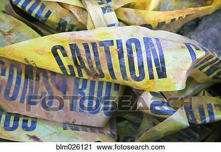 A pile of discarded Caution Construction warning printed tapes View Large Photo Image Stock Image - A pile of discarded Caution Construction warning printed tapes . Fotosearch