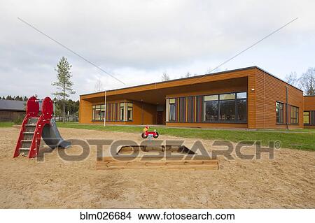 A play area with a slide and sandpit View Large Photo Image Picture - A play area with a slide and sandpit. Fotosearch