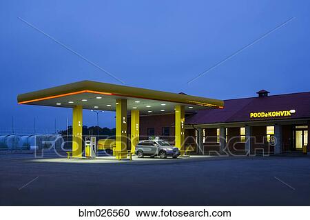 Stock Image - A roadside garage at night. Fotosearch