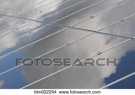 A row of solar panels installed in a rural situation View Large Photo Image Picture - A row of solar panels installed in a rural situation. Fotosearch