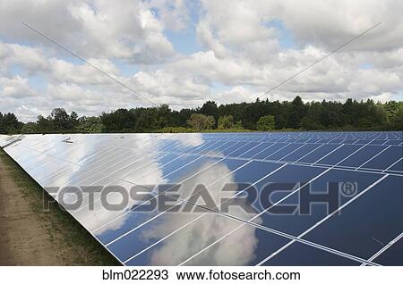 Stock Image - A row of solar panels installed in a rural situation. Fotosearch