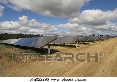 Stock Photography - A row of solar panels installed in a rural situation. Fotosearch