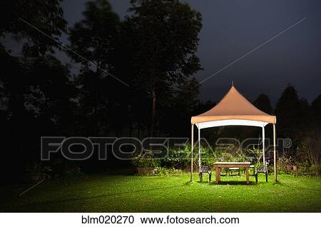 A small gazebo in a garden View Large Photo Image Stock Image - A small gazebo in a garden. Fotosearch