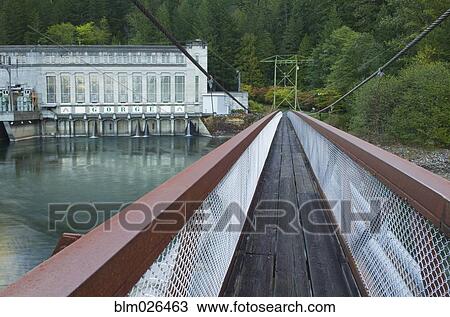 Stock Image - A suspension bridge over the Skagit River. Fotosearch
