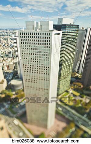 Stock Photo - A tall modern building, skyscraper near Shinjuku in downtown Tokyo. Fotosearch