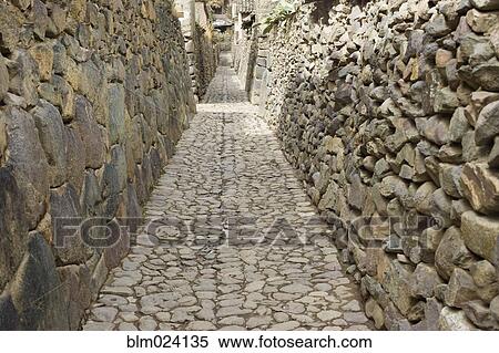 Stock Photography - A traditional wall in a street in the town of Ollantayambo. Fotosearch