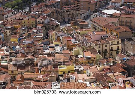 A view from above over the rooftops and historic buildings of the town of Bosa View Large Photo Image Stock Image - A view from above over the rooftops and historic buildings of the town of Bosa. Fotosearch