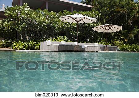 Stock Photo - A view of the infinity swimming pool . Fotosearch