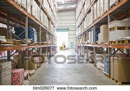 Stock Photo - A warehouse with stacked shelves. Fotosearch