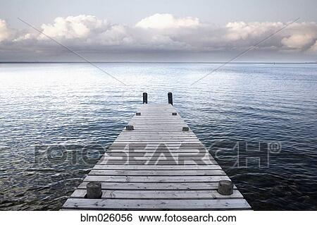 A wooden jetty reaching out into the waters of Lake Taupo View Large Photo Image Stock Photograph - A wooden jetty reaching out into the waters of Lake Taupo. Fotosearch