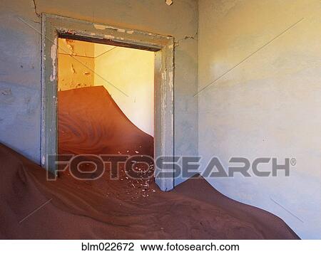 Stock Image - Abandoned House Filled with Drifting Sand. Fotosearch