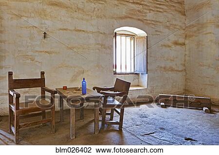 Adobe walled room with rough hewn table and chairs View Large Photo Image Stock Image - Adobe walled room with rough hewn table and chairs. Fotosearch