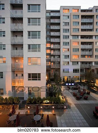 Stock Image - Apartment Courtyard At Dusk. Fotosearch