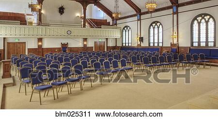 Auditorium with blue chairs, and a stage with curtains View Large Photo Image Stock Image - Auditorium with blue chairs, and a stage with curtains. Fotosearch