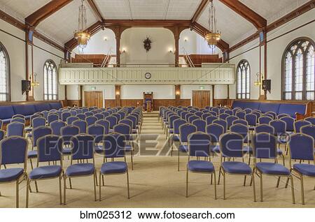 Auditorium with blue chairs, and a stage with curtains View Large Photo Image Stock Image - Auditorium with blue chairs, and a stage with curtains. Fotosearch