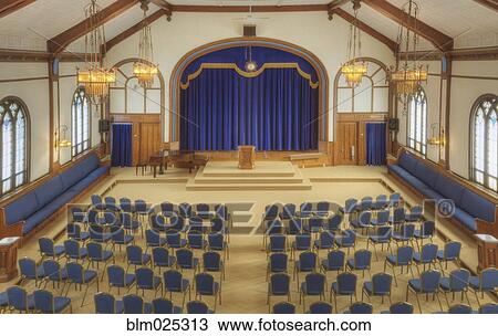 Auditorium with blue chairs, and a stage with curtains View Large Photo Image Stock Image - Auditorium with blue chairs, and a stage with curtains. Fotosearch