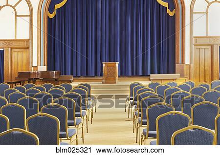 Auditorium with blue chairs, and a stage with curtains View Large Photo Image Stock Image - Auditorium with blue chairs, and a stage with curtains. Fotosearch