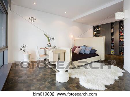 Stock Image - Bed and Desk in Bedroom. Fotosearch