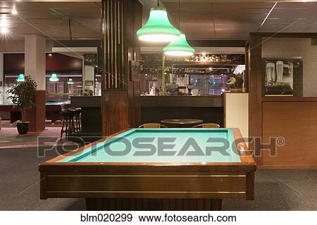 Billiards table in front of a bar in a pool center in The Hague, Netherlands View Large Photo Image Stock Photo - Billiards table in front of a bar in a pool center in The Hague, Netherlands. Fotosearch