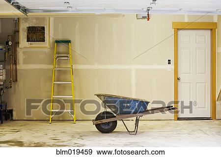Blue Wheelbarrow in Garage View Large Photo Image Stock Photo - Blue Wheelbarrow in Garage. Fotosearch