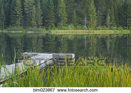 Stock Photo - Boat dock on Black Pine Lake. Fotosearch
