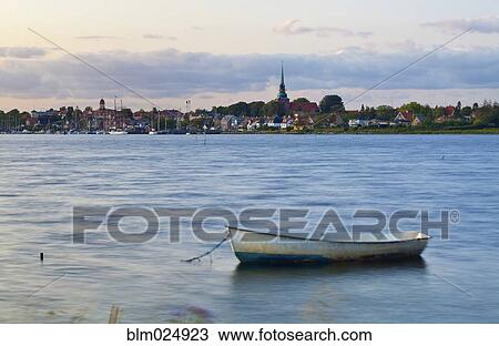 Stock Image - Boat Docked in Harbor. Fotosearch