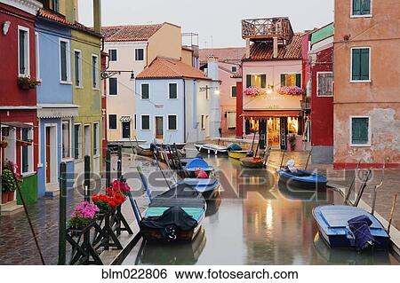 Stock Photograph - Boats in Burano Canal During a Rain Shower. Fotosearch