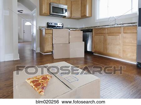 Boxes and cartons stacked in a house View Large Photo Image Stock Photograph - Boxes and cartons stacked in a house. Fotosearch