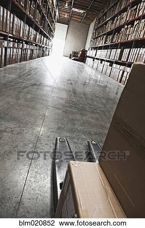 Stock Image - Boxes of Material Stacked on Shelves. Fotosearch