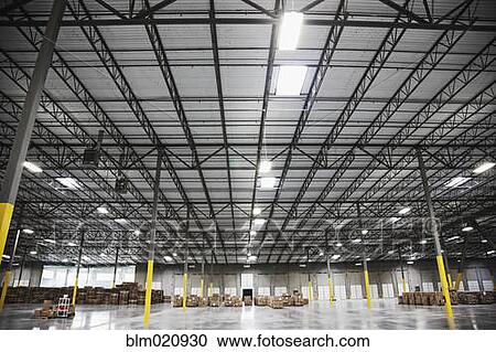 Stock Image - Boxes on Pallets in a Warehouse. Fotosearch