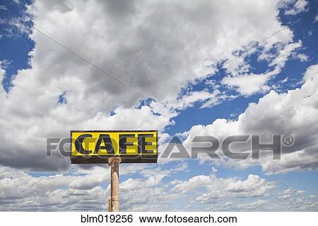 Cafe sign against cloud filled sky View Large Photo Image Stock Photograph - Cafe sign against cloud filled sky. Fotosearch