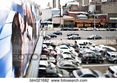 Stock Image - Cars Parked in a Parking Lot. Fotosearch